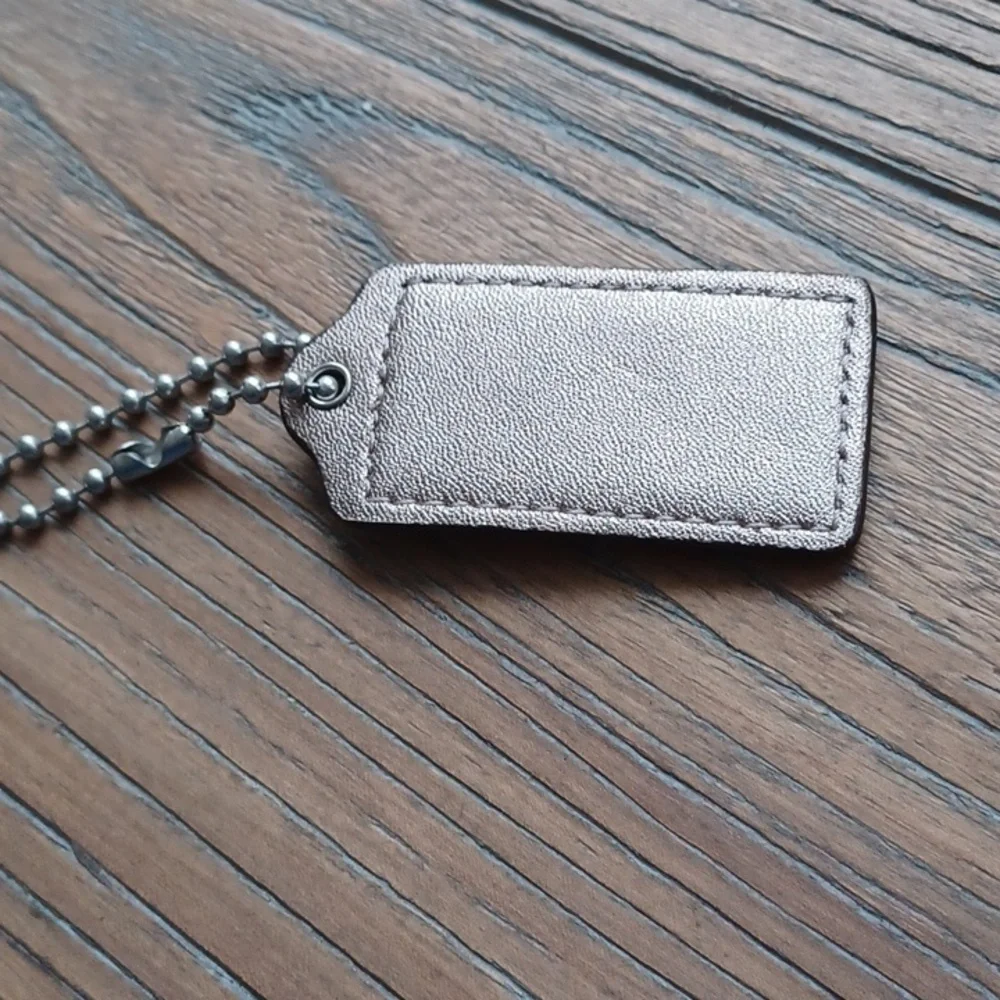 Coach Matallic Gold Color Keychain Tag